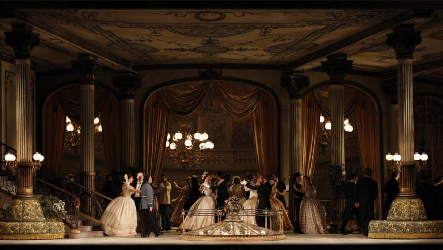 People dance at a ball.