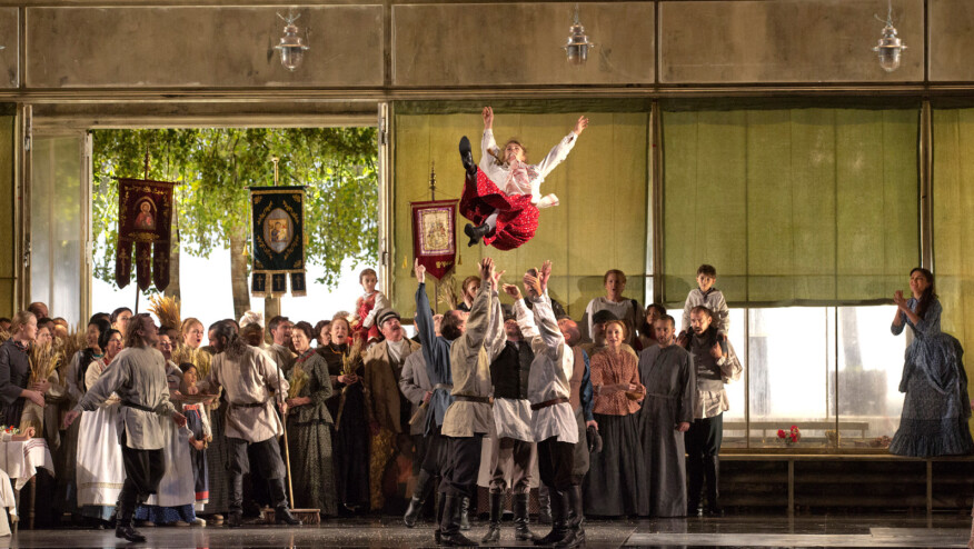 A woman is thrown into the air by a lively crowd.