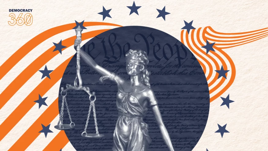 A lady with a scale and a blindfold on top of the U.S. Constitution, surrounded by stars.