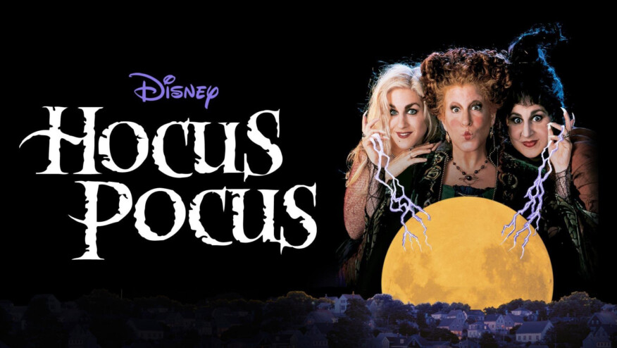 Three witches draw power from a full moon over a small town. Text reads, 