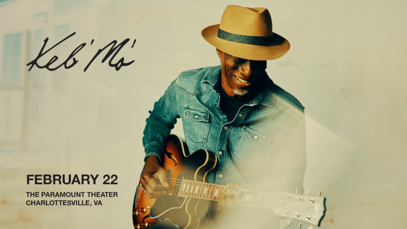 A man in a hat smiles and plays the guitar. Text reads, 